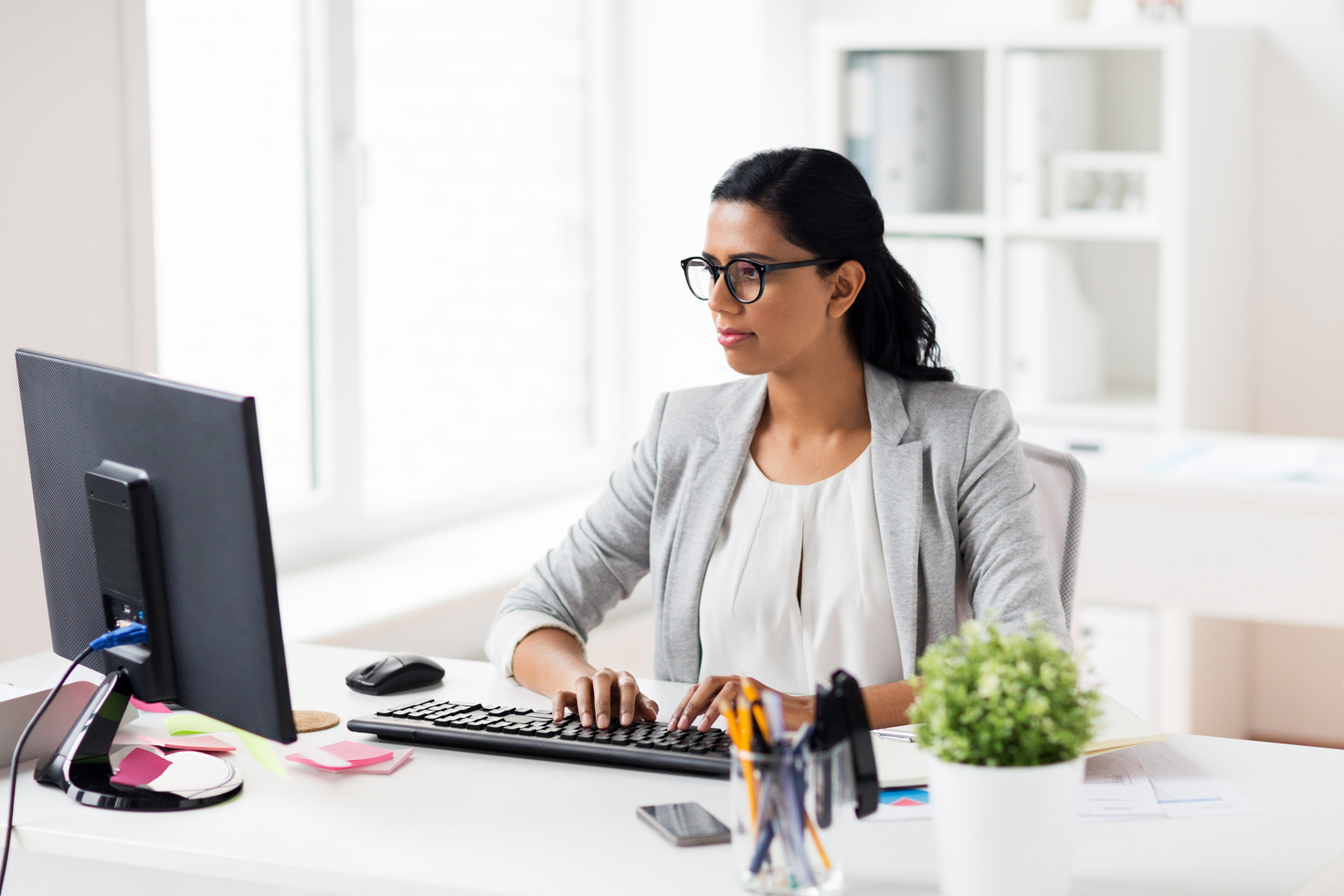 Woman Working at Her Office Desk